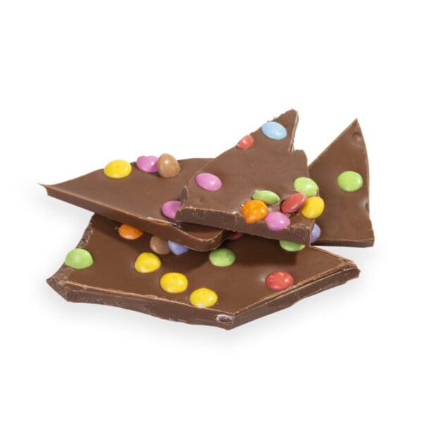 Homemade Chocolate Confetti Slab crafted from the finest milk chocolate and dotted with colorful mini-Smarties. Expertly blended by our Master Chocolatiers, this slab offers a delightful blend of creamy chocolate and playful crunch. A radiant choice for sharing, personal treat, or gifting, it's a vibrant celebration of flavors in every bite.
