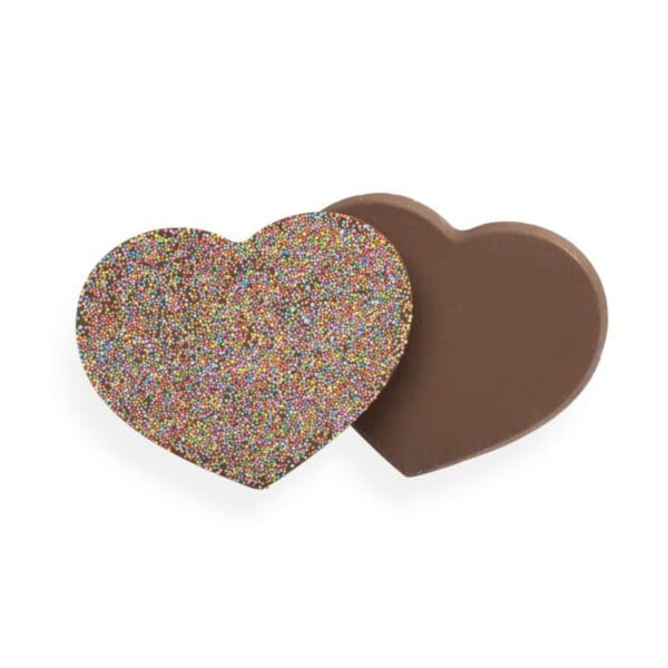 Fall in love with our homemade Milk Chocolate Heart – a scrumptious treat that’s almost too pretty to eat. Made from our smooth milk chocolate and coated in a rainbow of colourful sprinkles, this heart-shaped delight is the perfect way to show someone you care. Whether you’re looking for a sweet surprise for your sweetheart or a tasty treat to brighten someone’s day, our latest creation is sure to steal their heart.