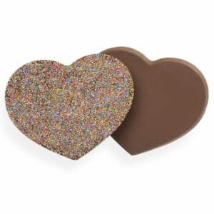 Fall in love with our homemade Milk Chocolate Heart – a scrumptious treat that’s almost too pretty to eat. Made from our smooth milk chocolate and coated in a rainbow of colourful sprinkles, this heart-shaped delight is the perfect way to show someone you care. Whether you’re looking for a sweet surprise for your sweetheart or a tasty treat to brighten someone’s day, our latest creation is sure to steal their heart.