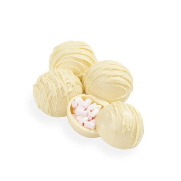 Looking for a deliciously explosive hot chocolate experience? Look no further than our creamy White Chocolate Bombs. These handmade white chocolate balls are filled to the brim with fluffy marshmallows, just waiting to burst into a heavenly hot chocolate with the addition of hot milk. As the chocolate ball slowly melts away, it reveals the ooey-gooey goodness hidden inside – creating a mouth-watering and cosy experience like no other. Whether you’re curled up by the fire or just in need of a little pick-me-up, our White Choc Bombs are the perfect treat to add some extra sweetness to your day. So go ahead and indulge – your taste buds (and your soul) will thank you.