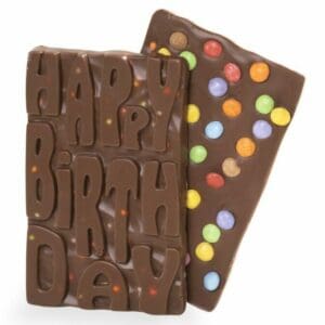 Celebrate in style with our Happy Birthday Chocolate Bar – the perfect gift for any chocolate-loving birthday boy or girl! Made from our creamy homemade milk chocolate, and for an extra pop of colour and crunch, the bar is studded with rainbow confetti made from delicious Smarties. So go ahead, break out the party hats and blow out the candles – our Happy Birthday Bar is here to make your celebration even sweeter