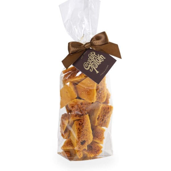 Succulent Homemade Honeycomb, made from local honey. wrapped here in clear cellophane packaging and with a decorative ribbon.