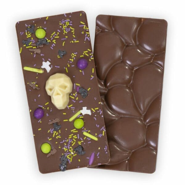 Creamy Milk Chocolate Halloween Skulls Bar, a rich and enchanting treat with nostalgic flavors, wrapped in spooky skulls for an eerie, elegant Halloween indulgence.