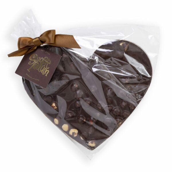 Experience the ultimate chocolate pleasure with our Dark Chocolate Hazelnut Heart, a scrumptious treat that’s almost too pretty to eat. Made with our premium dark chocolate and filled with roasted, caramelized hazelnuts, this heart-shaped delight is perfect for satisfying your sweet cravings. The smooth and rich dark chocolate beautifully complements the crunchy and nutty texture of the hazelnuts. Whether it’s for a romantic gesture or showing some self-love with an indulgent treat, our latest creation is the perfect way to show your love and is sure to steal your heart with every bite.