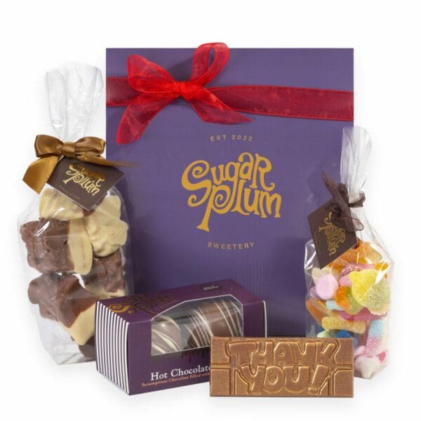 Our Deluxe Thank You Bundle, consisting of chocolate honeycomb, hot chocolate bombs, a thank you bar, and pick and mix sweets. Coming in a luxurious purple box. Delivery nationwide from our online sweetshop.