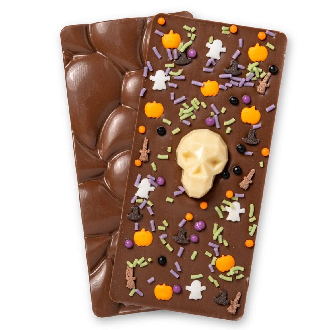 Sugar Plum Sweetery Halloween milk chocolate bar decorated with a white chocolate skull, orange pumpkins, ghosts, witches hats and Halloween sprinkles